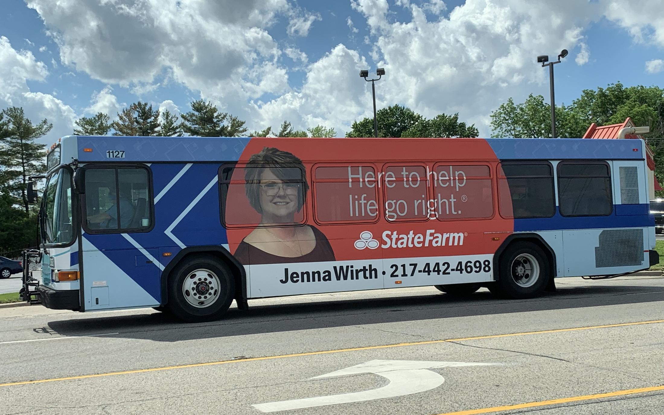 Advertisement wrap on a bus in Danville for State Farm