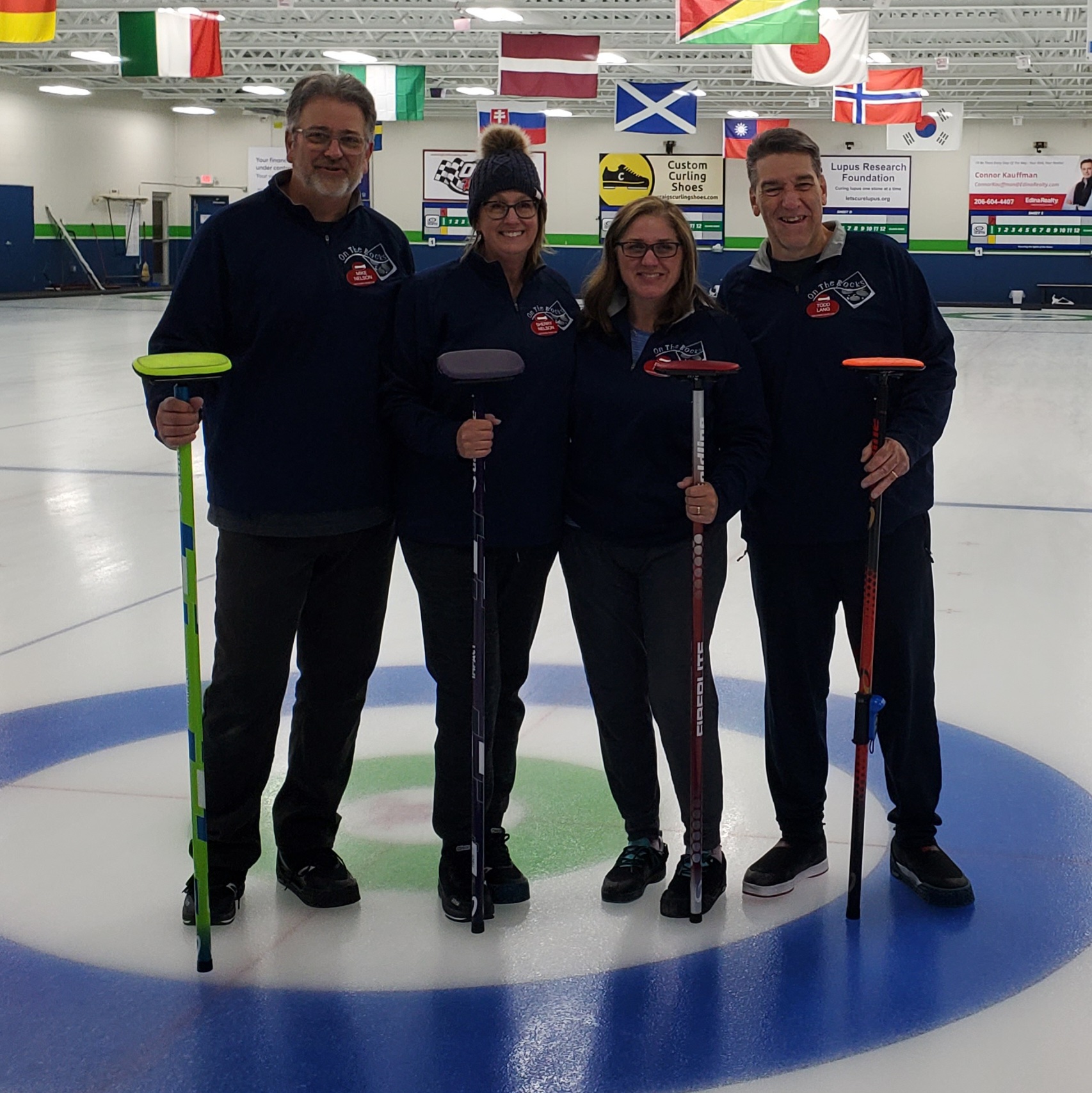 Emily posing with her curling team